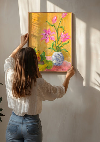 Lillies by Deblina Dey being hung on a sunlit wall