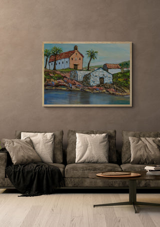 Chapel by the Water by PaKart in an oak frame above a grey sofa with cushions