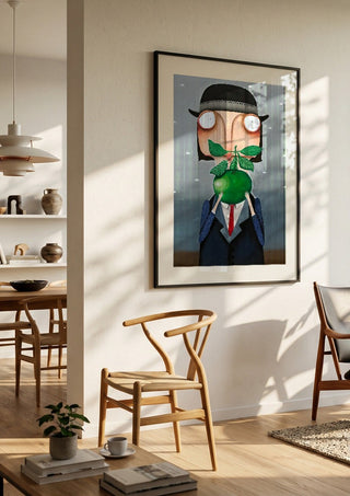Die Apfelallergie by lacaluna in a black frame in a bright dining room with wooden chairs