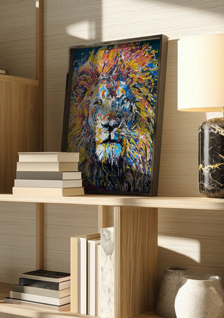 Soul of a Lion by Bibi in a dark frame on a wooden shelf beside books and a lamp