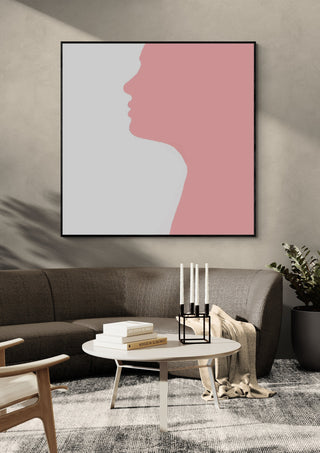Pure by Tonia in a black frame above a grey sofa with candlesticks
