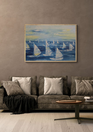 Sailing Free by Sabine Halbrock in an oak frame above a grey sofa with cushions