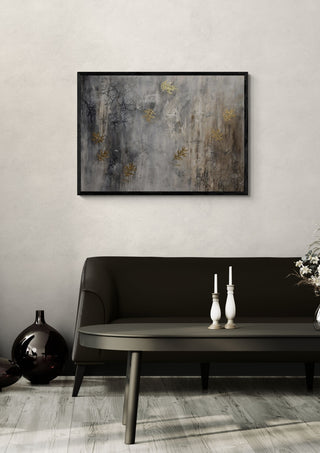 Letting go by Sabine Halbrock in a black frame above a dark sofa with white candlesticks