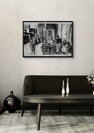 Maqha Al-Darwishia by Ammar in a black frame above a dark sofa with white candlesticks