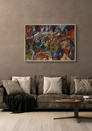 Torn between lovers by Will Black in an oak frame above a grey sofa with cushions