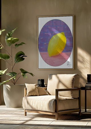 ABCitron by L.OE. Art framed above a beige armchair beside a potted plant