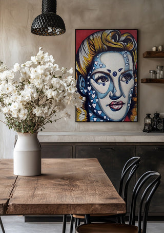 Pinup Girl by Okiana in a black frame above a rustic table with white flowers