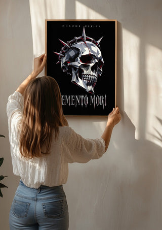 Memento Mori by Melancholy Machinations being hung on a sunlit wall