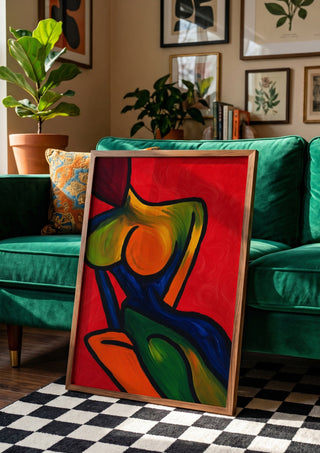 Anatomy of Introspection by Bibi in a wooden frame beside a green velvet sofa on a chequered floor