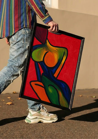 Anatomy of Introspection by Bibi carried in a black frame along a sunny street