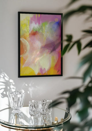 Color rond by FridaRit in a black frame above a glass table with crystal glassware
