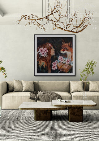 Anne´s Fox encounter by Elisa Kay framed above a long sofa under a branch chandelier
