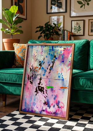 Seventy Nine by Maria Umrikhina in a wooden frame beside a green velvet sofa on a chequered floor