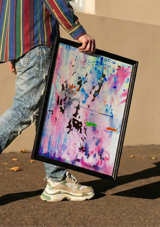 Seventy Nine by Maria Umrikhina carried in a black frame along a sunny street