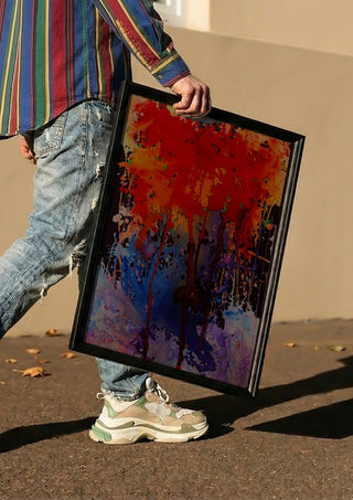 Untitled by Maria Umrikhina carried in a black frame along a sunny street