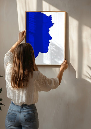 Projected personality by Tonia being hung on a sunlit wall