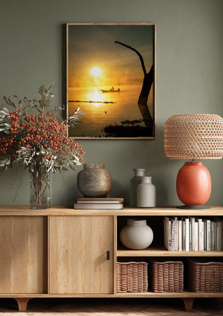 Fishermen Of Naivasha by Gloria Mwivanda above a wooden sideboard on a sage green wall