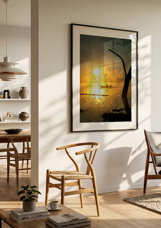Fishermen Of Naivasha by Gloria Mwivanda in a black frame in a bright dining room with wooden chairs