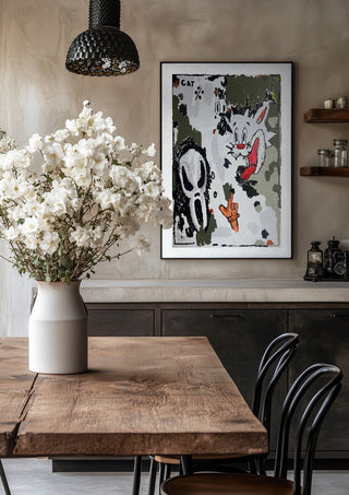 BALLER’INA ESCORT by Oscar Birch in a black frame above a rustic table with white flowers