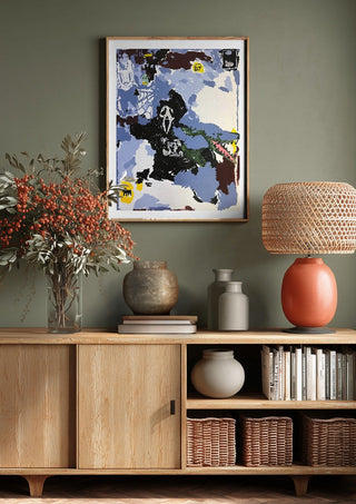 LOVE IS A DOG FROM HELL by Oscar Birch above a wooden sideboard on a sage green wall