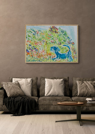 Blue Cat in the Garden by Eva Hartman in an oak frame above a grey sofa with cushions
