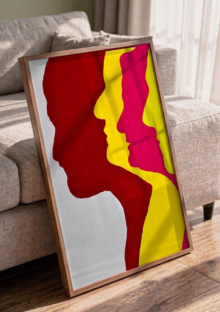 Genesis by Tonia in a walnut frame leaning against a grey sofa
