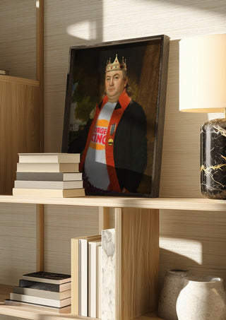 Fast Food King by Dikhotomy in a dark frame on a wooden shelf beside books and a lamp
