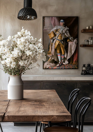 Cool King by Dikhotomy in a black frame above a rustic table with white flowers