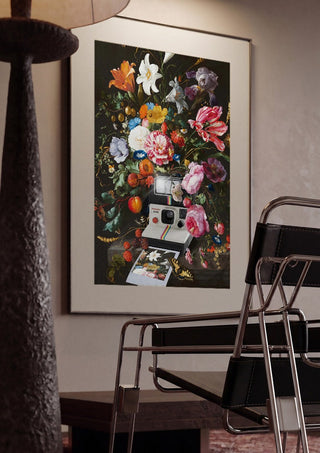 Floral Instant Photo by Dikhotomy framed in a dim room beside a tubular steel chair