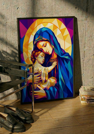 Virgin Mary and Baby Jesus by nyai in a black frame leaning against a concrete wall by a steel chair