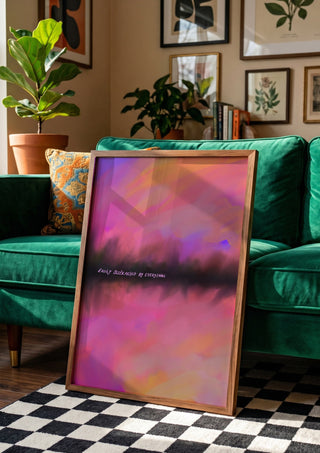 Easily distracted by everything by Astrid Lind in a wooden frame beside a green velvet sofa on a chequered floor
