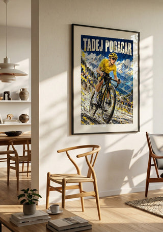Tadej Pogacar by Danii Steinfeldt in a black frame in a bright dining room with wooden chairs