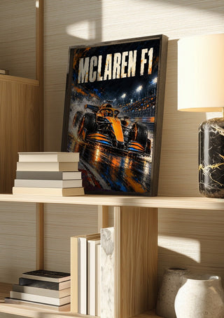 McLaren F1 by Danii Steinfeldt in a dark frame on a wooden shelf beside books and a lamp
