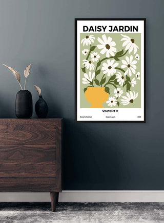 Framed "Daisy Jardin No 1 - Vincent V." floral art poster displayed above a wooden dresser in a modern room.