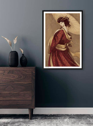 Framed art print of a geisha in a red kimono by Kate Aitana, displayed on a dark gray wall above a dresser.