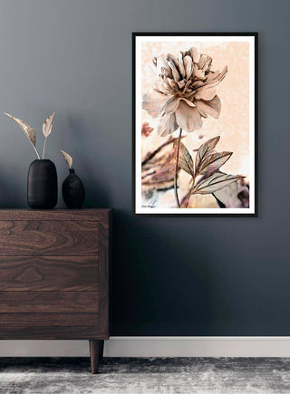 Framed "Dandelion Beauty" artwork by Kate Aitana displayed on a dark wall above a wooden dresser.