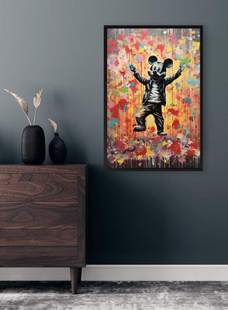 Framed Mickey - Inspired on Banksy artwork featuring vibrant, graffiti-style colors hangs above a modern dresser.