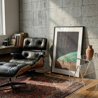 Framed art print of "The Others" by Frank Moth leaning against a wall in a stylish, modern living space.