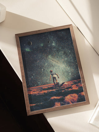 Framed Nostalgia - Frank Moth print showing a person gazing at a cosmic sky over a surreal landscape.