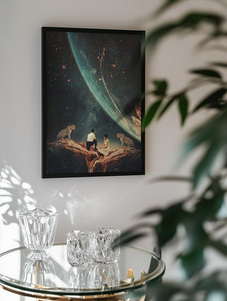 Framed "Guardians of Our Future" artwork by Frank Moth hanging above a glass table with crystal decor.