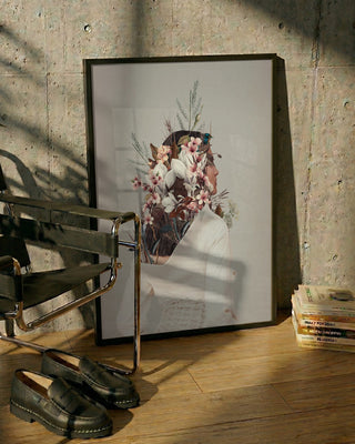 Framed You Gifted Me an Autumn - Frank Moth print leaning against a wall beside books, shoes, and a chair.