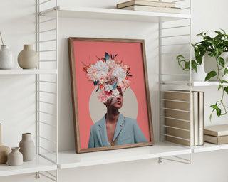 Framed "Searching for Sunrise" by Frank Moth featuring a floral surreal portrait, displayed on a white shelf.