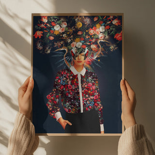 Hands holding "Bright Bloom" by Frank Moth, featuring a woman with vibrant flowers blooming from her head.