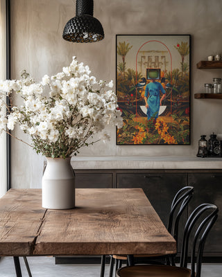 Framed "Her Asymmetries" by Frank Moth on wall above rustic dining table with white flower vase.
