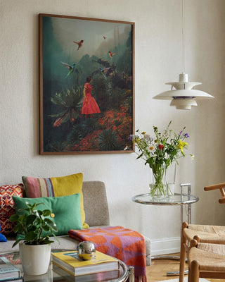 Framed "20 Seconds Before the Rain" by Frank Moth displayed above a cozy living room sofa with colorful pillows.