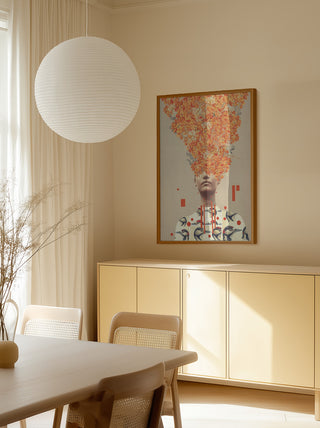 Framed "Bird Flight In Autumn" by Frank Moth displayed above a sideboard in a modern, light-filled room.