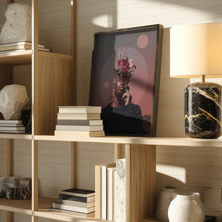 Framed "Pale Memories of Dusk" by Frank Moth displayed on a modern wooden shelf with books and decor.