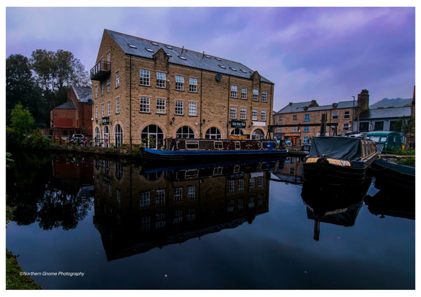 Canal Wharf at Dusk by Northern Gnome Photography - stone mill and narrowboats reflected in a canal at dusk