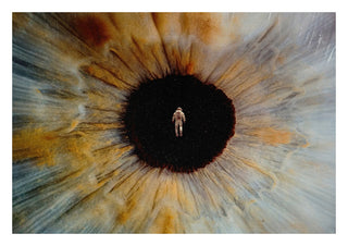 Inner Space by Fran Rodriguez - an astronaut floating in the black pupil of a huge amber and blue eye