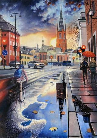 Stockholms promenad by Ramz Gadzh - a cyclist on a wet Stockholm street with a church spire mirrored in a puddle